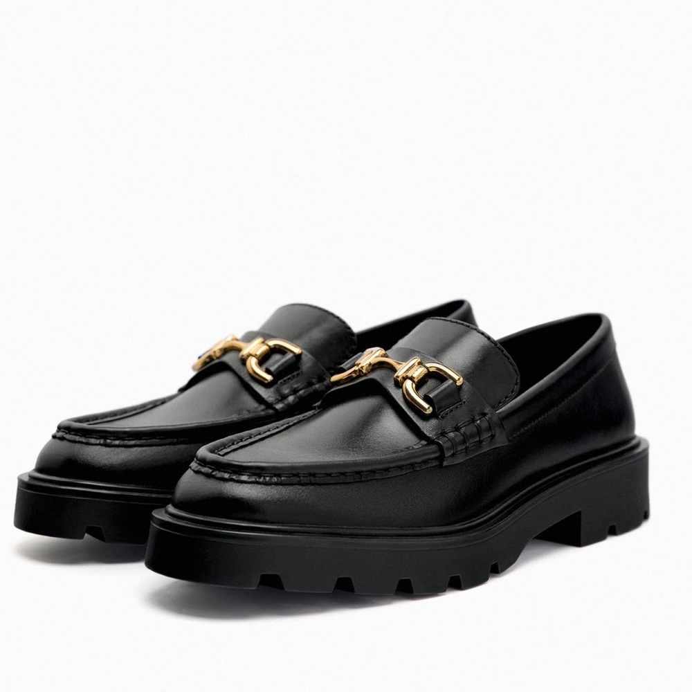 Lug Sole Black Leather Loafers with gold metal detail